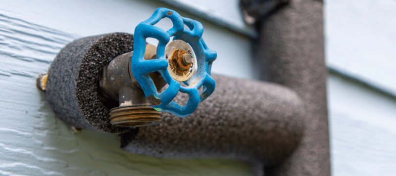 closeup of a water spout covered in winterization tubing